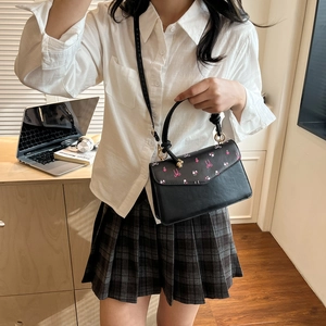 Fashionable black square handbag with pink bows and floral prints for women