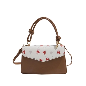 Fashionable brown and white crossbody bag with cute bear heart patterns and knotted handle