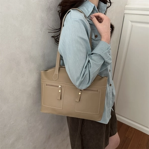 Retro khaki tote bag with double front zip pockets and long shoulder straps