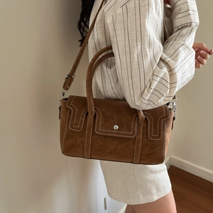 Vintage brown crossbody bag with contrast stitching and adjustable shoulder strap