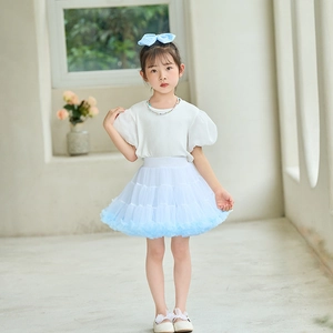 Detail of light blue layered tulle tutu skirt for girls with soft gradient texture