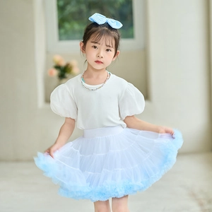 Detailed view of layered white and blue gradient tulle tutu skirt with elastic waistband