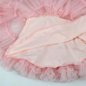 Detail view of pink tutu skirt featuring multi-layer fine mesh and soft knit lining