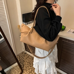 Soft khaki faux leather tote bag with stylish pleated design and adjustable shoulder strap