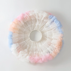 Flat lay of rainbow pastel tiered tulle tutu skirt for girls with soft layered ruffles