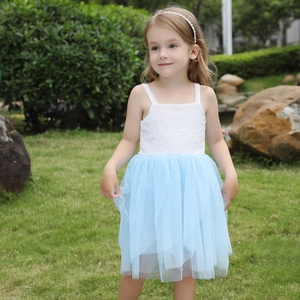 Detail of white lace bodice and light blue tulle skirt on summer girls' sundress