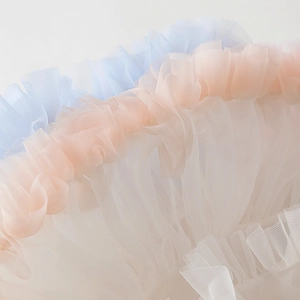Detailed macro view of multi-layered pastel tulle ruffles for girls' tutu skirt