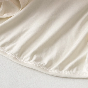 Close-up of premium soft knit cotton fabric texture and hem stitching on kids tutu set