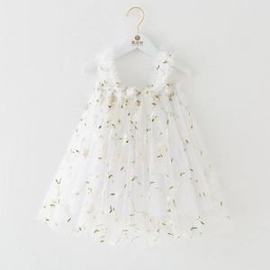 Close-up of white mesh princess dress featuring delicate floral embroidery and ruffled straps
