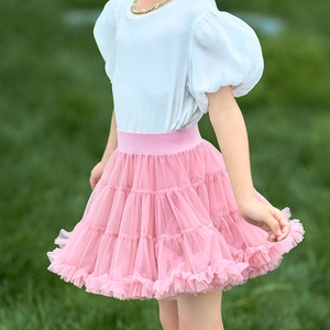 Detail of pink multilayered tulle tutu skirt with elastic waistband for girls
