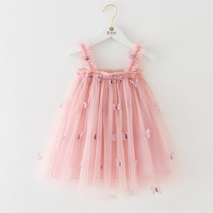 Detail of pink girls tulle dress featuring 3D purple butterfly appliques and ruffled straps