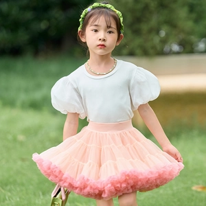 Detail of pink tiered mesh tutu skirt with elastic waistband for young girls