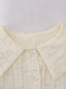 Girls beige short sleeve blouse with Peter Pan collar and crinkled texture fabric