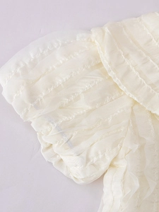 Girls' cream tutu set featuring layered tulle mesh top with ruffled puff sleeve details