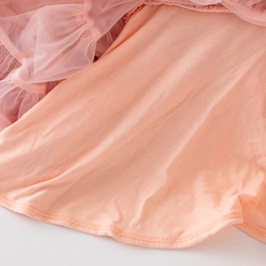 Detail of pink tutu skirt featuring soft mesh layers and durable double-stitched hem lining
