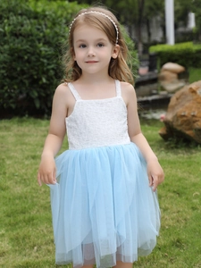 Girls summer white lace and blue mesh tutu dress worn by a young girl in a garden