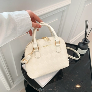Chic cream white quilted shell handbag with gold hardware and removable shoulder strap