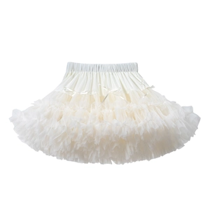 Close-up of multi-layer beige tulle tutu skirt with elastic waist and satin bows