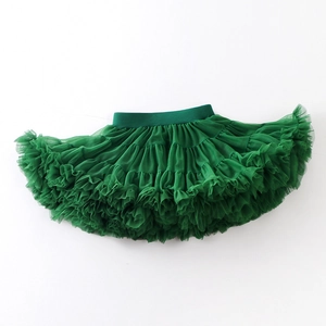Detailed close-up of dark green layered mesh tutu skirt with elastic waistband