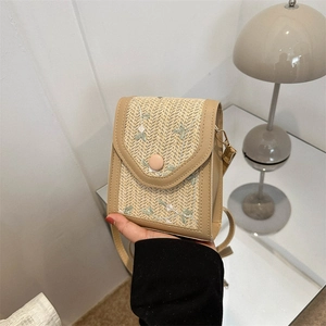 Fashionable straw crossbody bag with green floral embroidery and magnetic closure