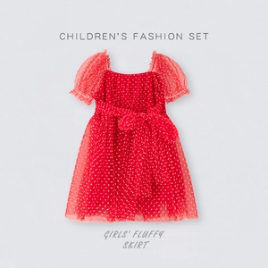 Detail of red polka dot tulle skirt with puffy sleeves and large bow waistband