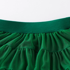 Detail of elastic waistband and dense layered mesh pleats on dark green tutu skirt
