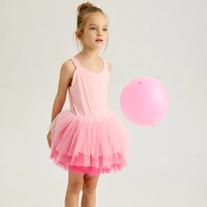 Detail view of pink ballet tutu dress featuring layered mesh tulle and elastic straps
