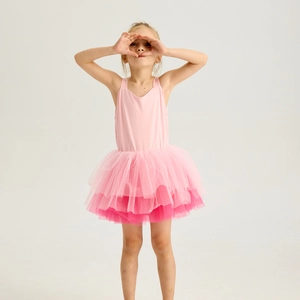 Detail of pink tiered tulle layers on girls ballet tutu dress with soft strap design