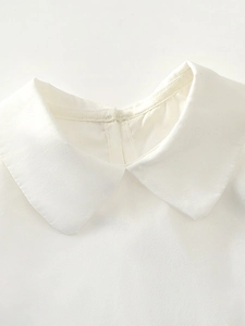 Girl's white cotton blouse with puff sleeves and Peter Pan collar detail for 2025 summer