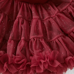Detail view of red tulle tutu skirt layers with sparkling silver glitter for girls