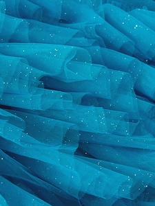 Teal tiered tulle girl dress fabric with silver glitter and voluminous mesh layers