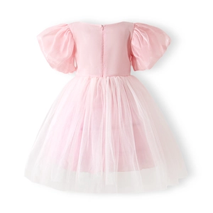 Detail view of pink girls' princess dress featuring puff sleeves and back zipper