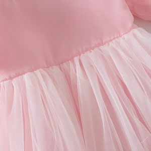 Detail of pink satin bodice and layered tulle skirt on a girl's princess dress