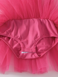 Close-up of rose pink ballet tutu multilayered mesh and elastic fabric stitching