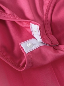 Detail view of the snap closure and crotch design of the girls' rose red ballet tutu