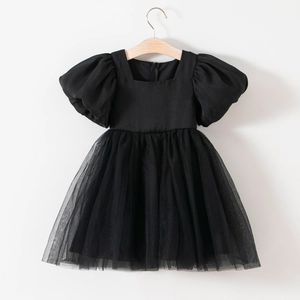 Detail of girls black tulle party dress with puff sleeves and square neckline