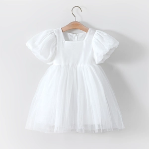 Detail of white tulle flower girl dress with puff sleeves and square neckline for kids