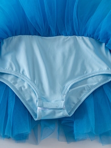 Detail of multi-layer blue mesh tutu skirt stitching and elastic knit fabric on dress