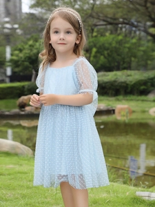 Light blue tulle girl dress with white polka dots and puff sleeves for summer 2025