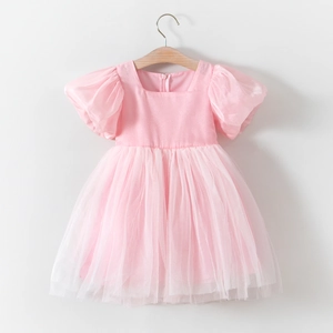 Detail of pink princess dress featuring a square neck, puff sleeves and layered mesh skirt