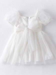 Elegant white girl's tulle dress with swiss dots, puff sleeves and a big back bow
