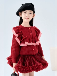 Girls red knit cardigan with ruffled details and matching tutu skirt outfit for Christmas