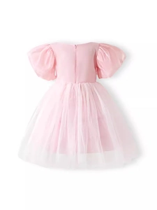 Pink toddler girl princess dress with puff sleeves and layered tulle skirt on white background