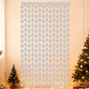 Close-up of silver Christmas tree tinsel curtain for festive holiday party wall backdrop