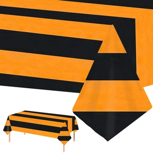 Detail view of the orange and black striped pattern on a rectangular disposable tablecloth