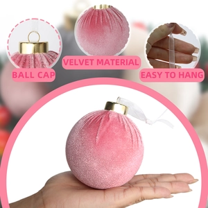 Pink velvet Christmas ball with gold cap and white ribbon for holiday tree decoration