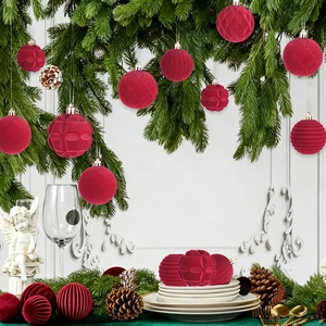 Detail of 6cm burgundy flocked Christmas balls with assorted textures hanging on pine branches