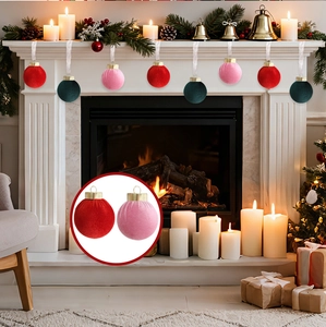 Velvet Christmas ornaments in red, pink, and green with golden caps by a festive fireplace