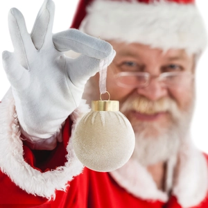 Close-up of velvet Christmas ball with fine vertical pleats and gold metal cap hanging