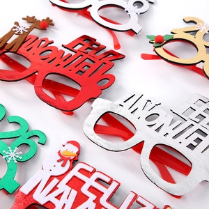 Close-up of Feliz Navidad glitter glasses frames with snowman and reindeer decorations